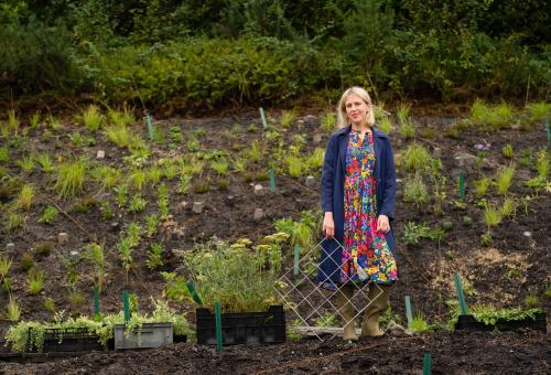 Artist Alexander Daisy Ginsberg at the Pollinator Pathmaker garden